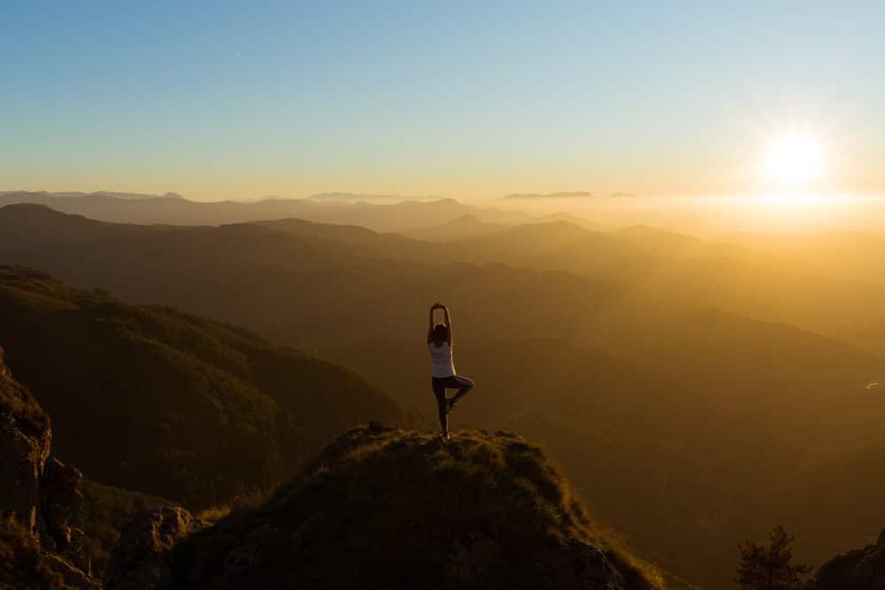 workout in sunrise on mountain peak